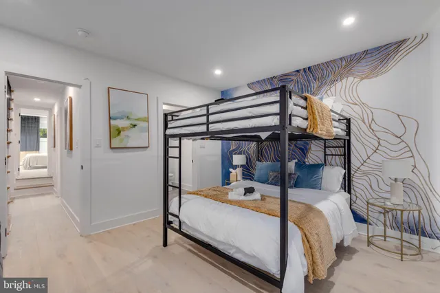 a bedroom with a bed and a couch