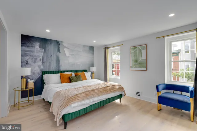 a bedroom with a bed and a television