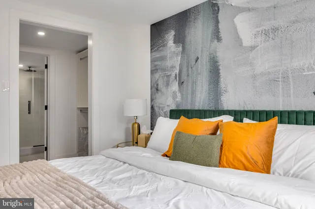 a bathroom with a glass shower door