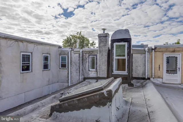 a brick building with a window and brick walls