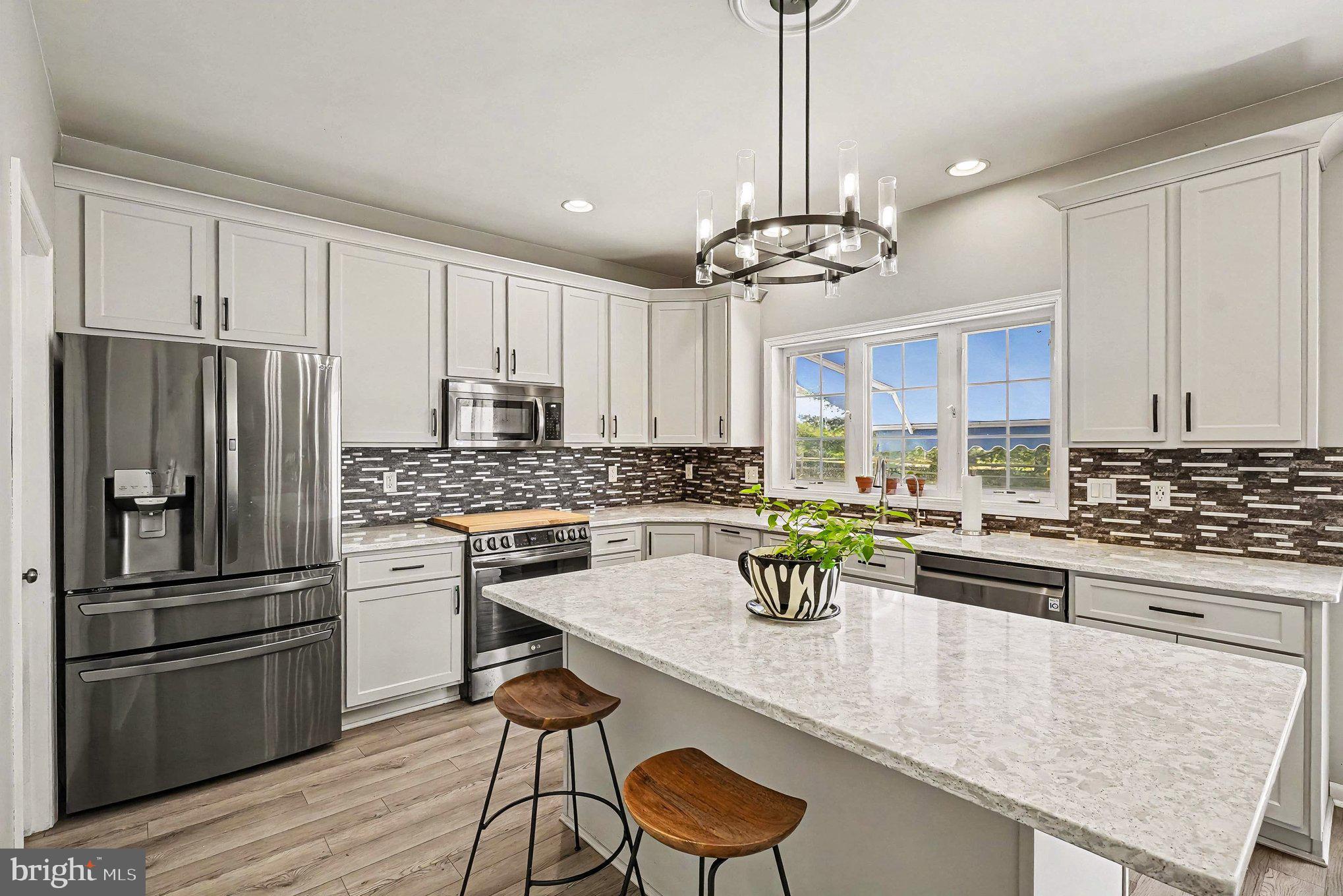 64 Open Meadow Court Elkton, MD 21921 - Photo 8 of 57 a kitchen with kitchen island a counter space a sink appliances and cabinets