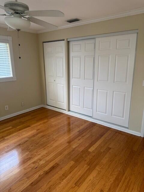1915 Arabian Road West Lake Clarke Shores, FL 33406 - Photo 8 of 18 a view of an empty room with wooden floor