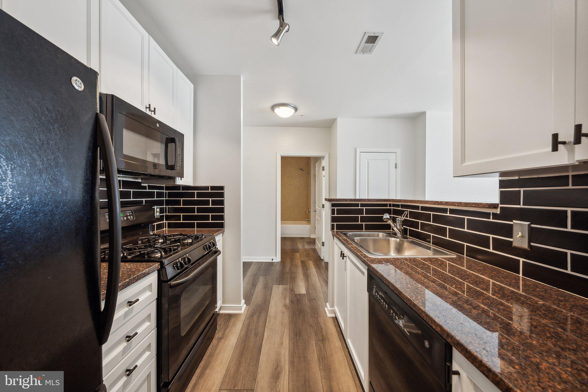 851 North Glebe Road, Unit 2008 Arlington, VA 22203 - Photo 12 of 37 Sleek kitchen with modern finishes.