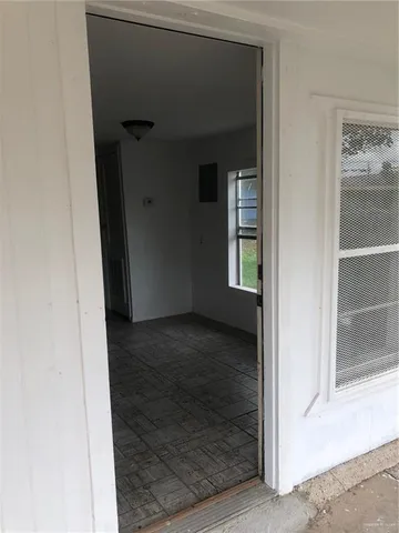 a view of an empty room with a window