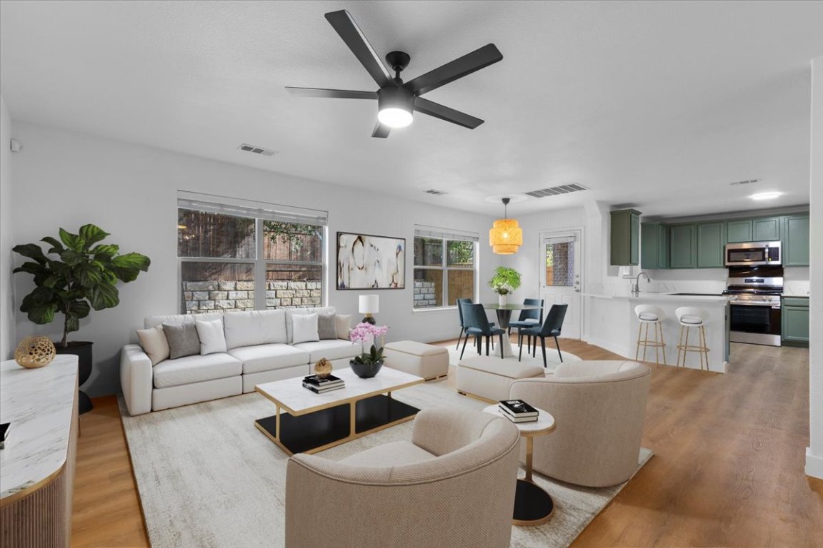 5940 Silver Screen Drive Austin, TX 78747 - Photo 1 of 17 a living room with furniture and a large window