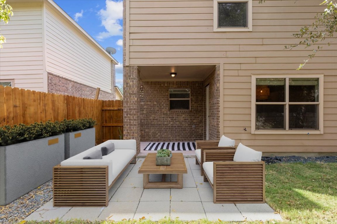 5940 Silver Screen Drive Austin, TX 78747 - Photo 14 of 17 a view of a patio with couches and wooden floor