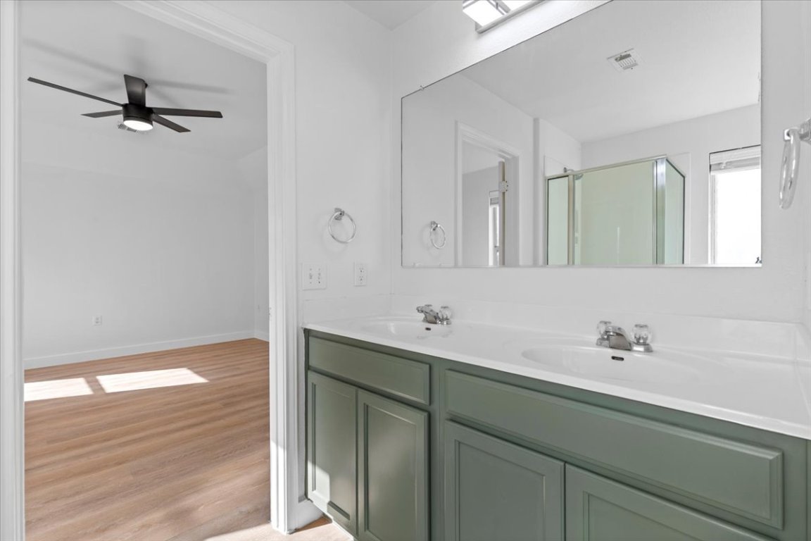 5940 Silver Screen Drive Austin, TX 78747 - Photo 8 of 17 a bathroom with a sink and a mirror