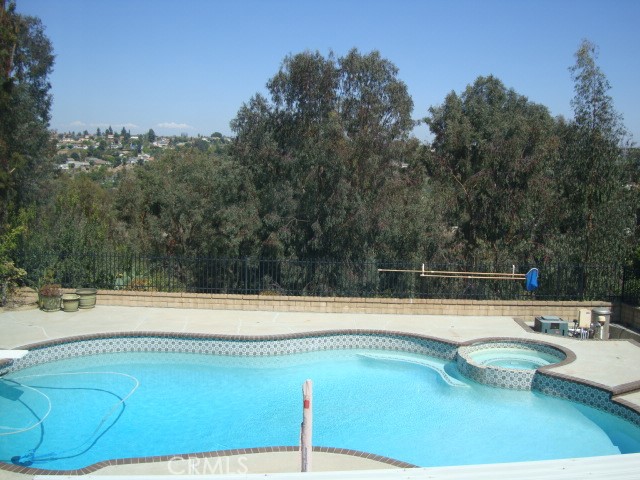 1920 Shaded Wood Road Diamond Bar, CA 91765 - Photo 2 of 7 a view of a swimming pool with a yard