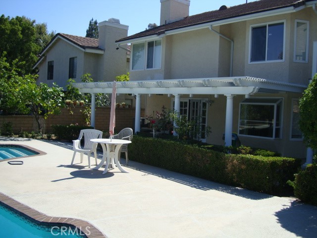 1920 Shaded Wood Road Diamond Bar, CA 91765 - Photo 6 of 7 a view of a patio with table and chairs and potted plants