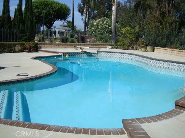 a view of a swimming pool with a patio