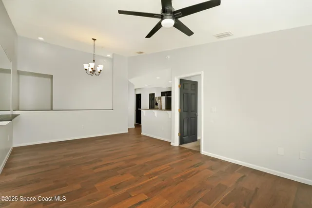 a kitchen with stainless steel appliances wooden cabinets and a stove top oven