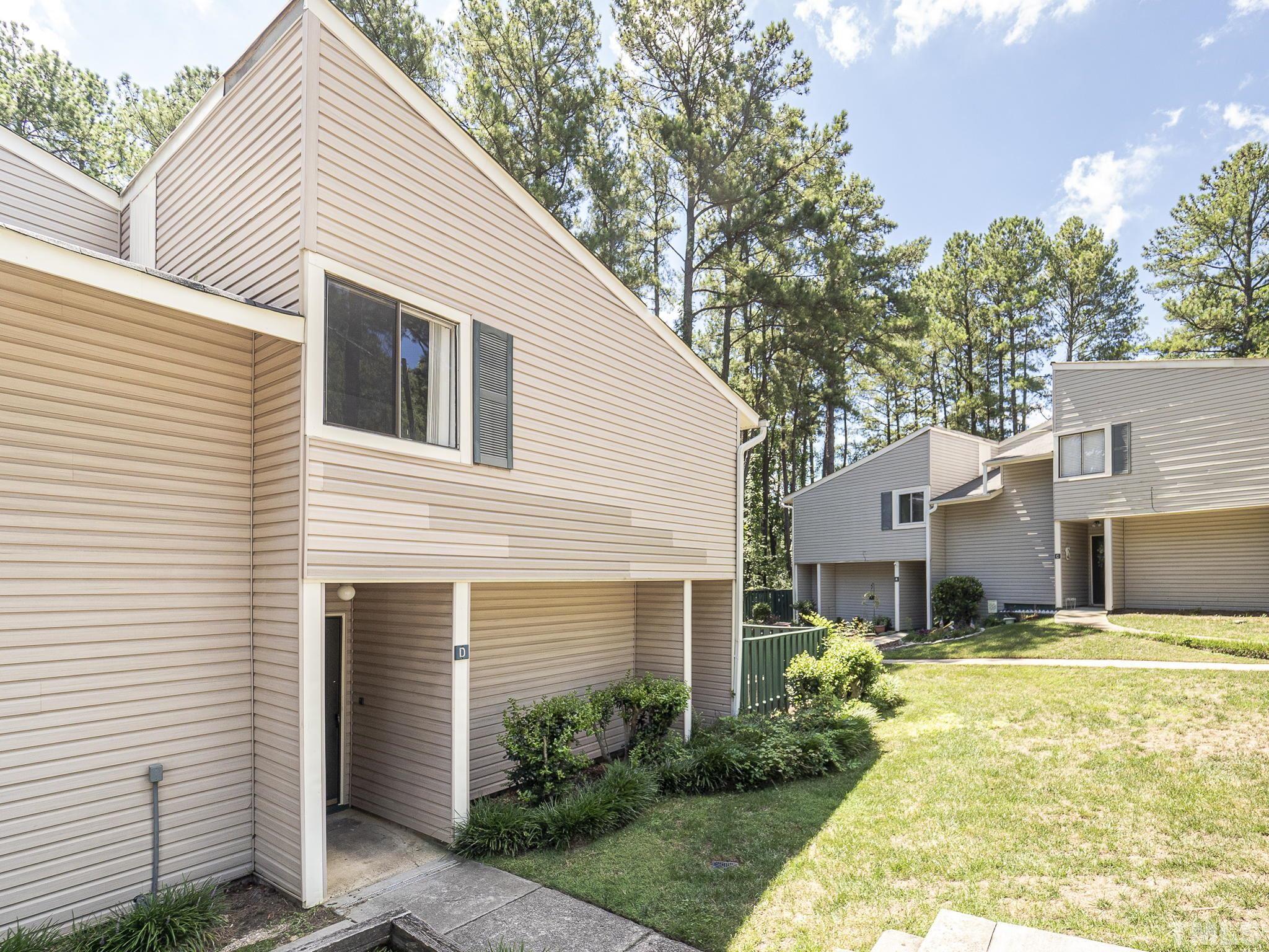 4705 Walden Pond Drive, Unit D Raleigh, NC 27604 - Photo 2 of 24 a front view of a house with garden
