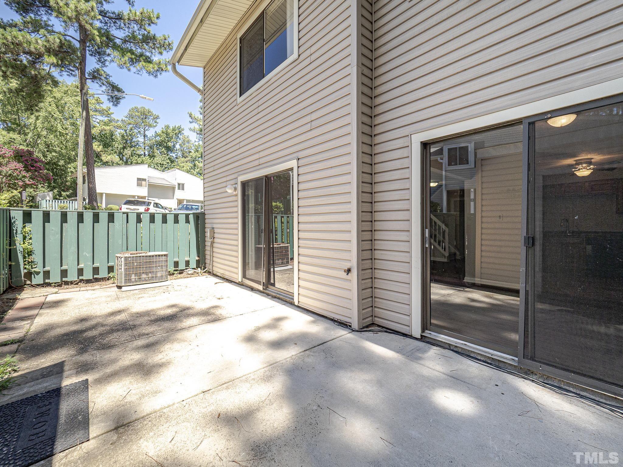 4705 Walden Pond Drive, Unit D Raleigh, NC 27604 - Photo 22 of 24 a view of a house with a wooden fence