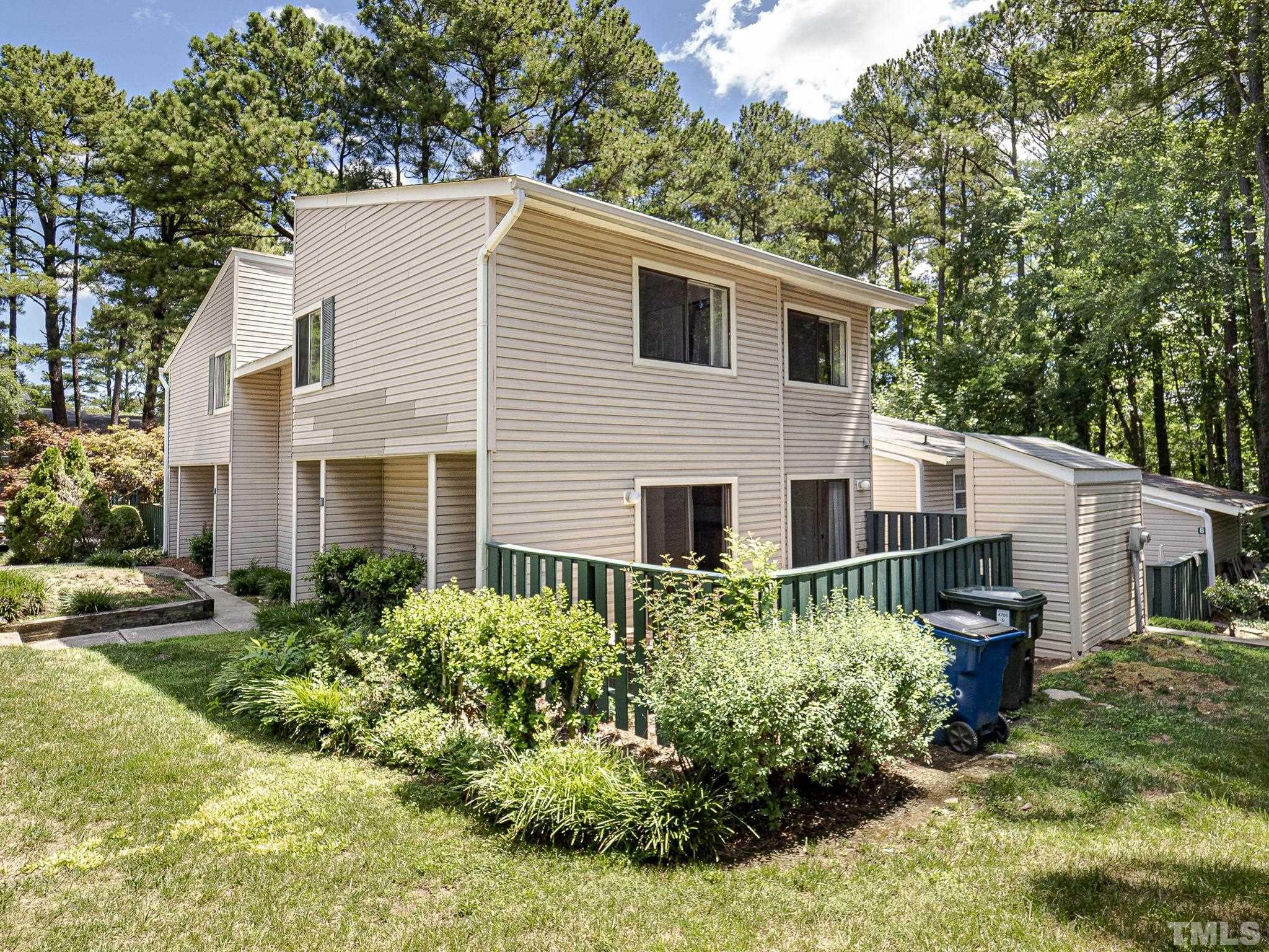 4705 Walden Pond Drive, Unit D Raleigh, NC 27604 - Photo 3 of 24 a view of a house with a yard and plants