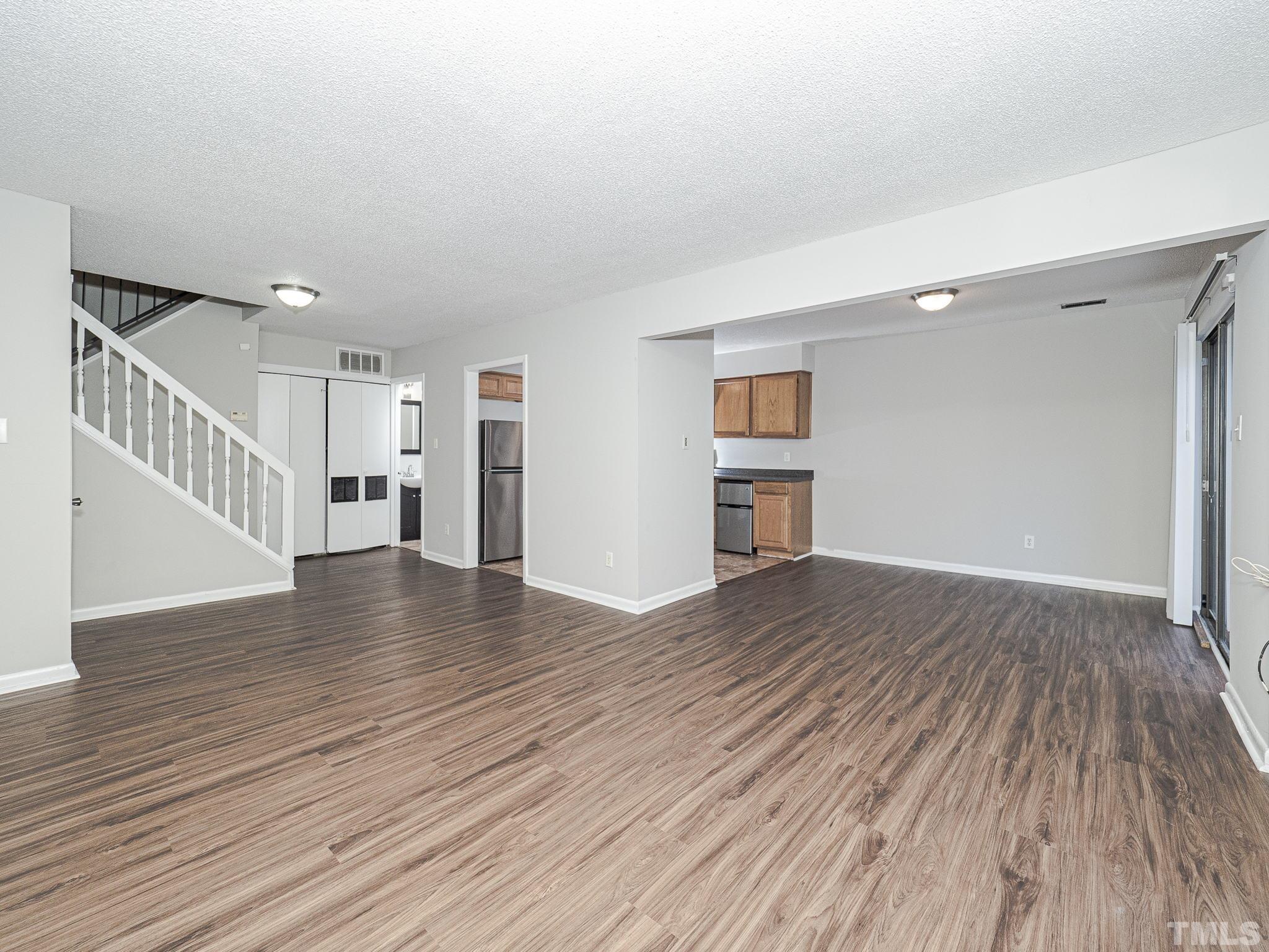 4705 Walden Pond Drive, Unit D Raleigh, NC 27604 - Photo 6 of 24 a view of empty room with wooden floor