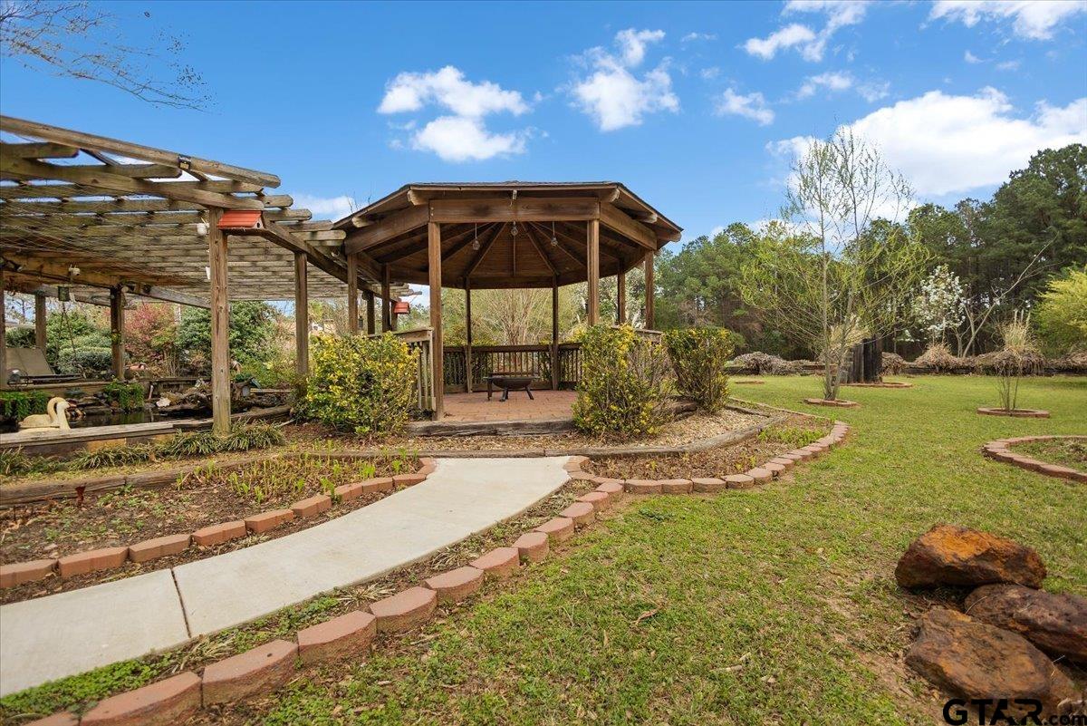 2320 Grangeway Road Marshall, TX 75672 - Photo 35 of 48 a view of a playground with a yard