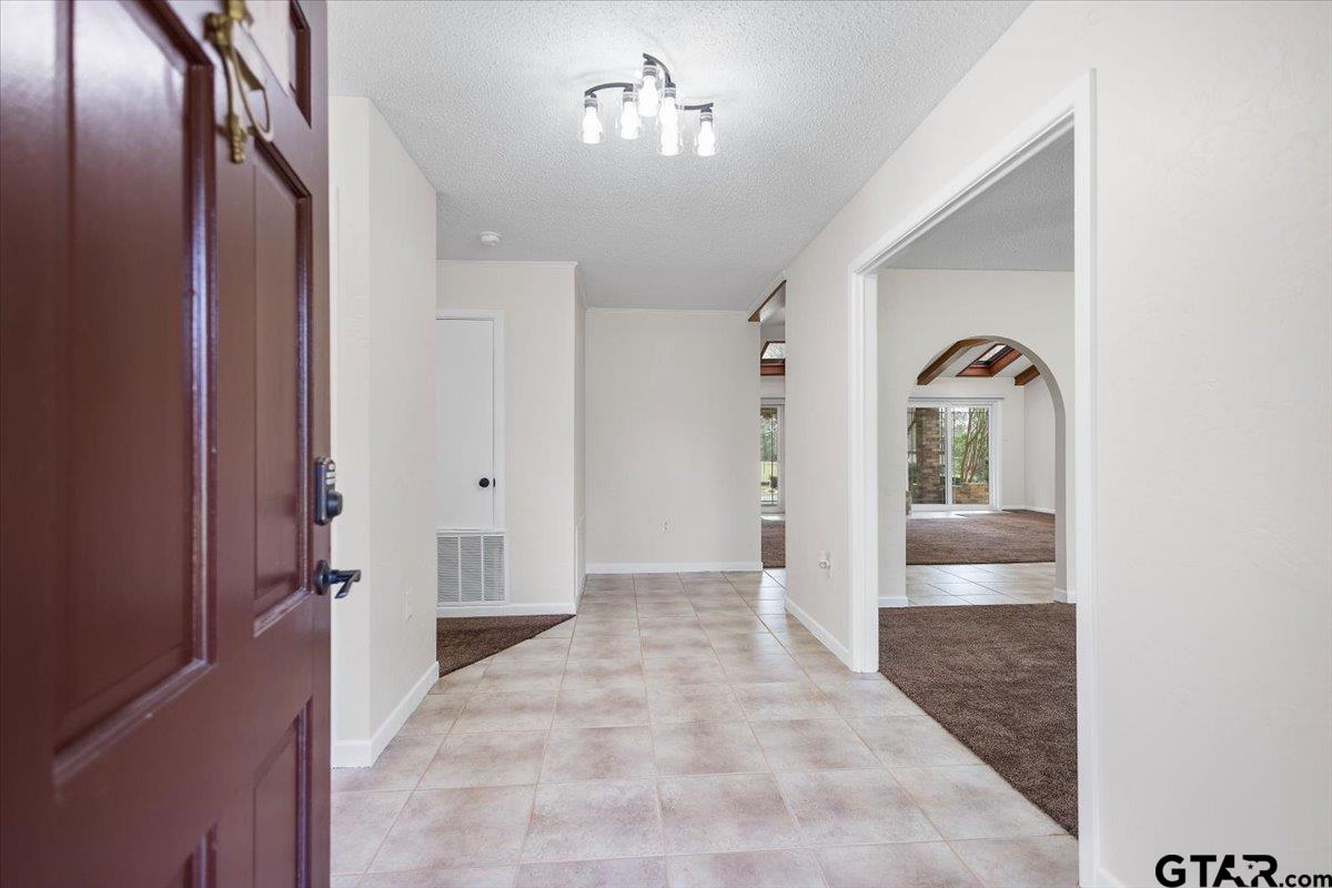2320 Grangeway Road Marshall, TX 75672 - Photo 4 of 48 a view of an entryway with wooden floor
