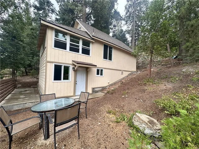 a view of a yard with a house and sitting area
