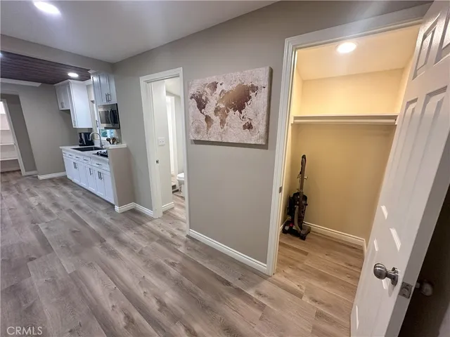 a view of a kitchen with a refrigerator and a window