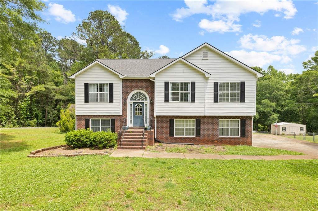 a front view of a house with a yard