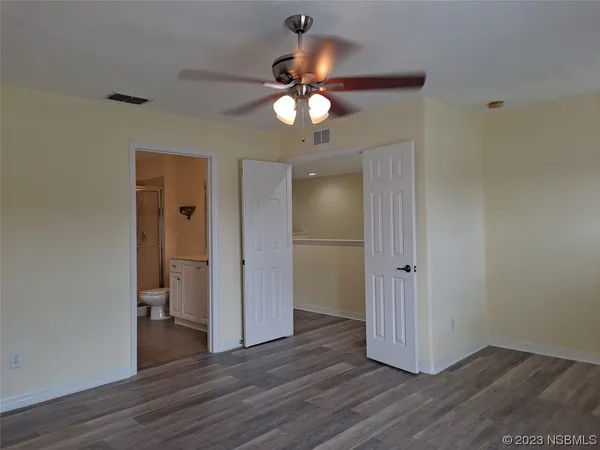 a view of a livingroom with wooden floor