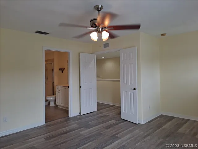 a view of a livingroom with wooden floor