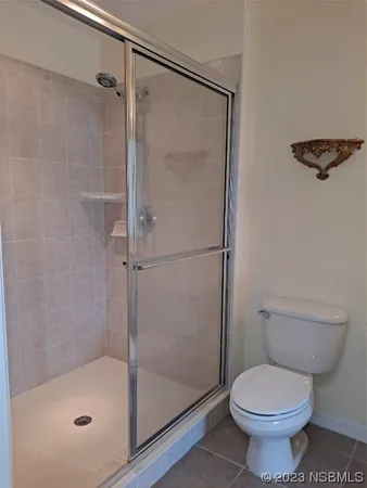 a bathroom with a shower and a toilet