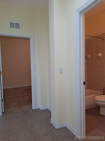a view of a bathroom with a toilet