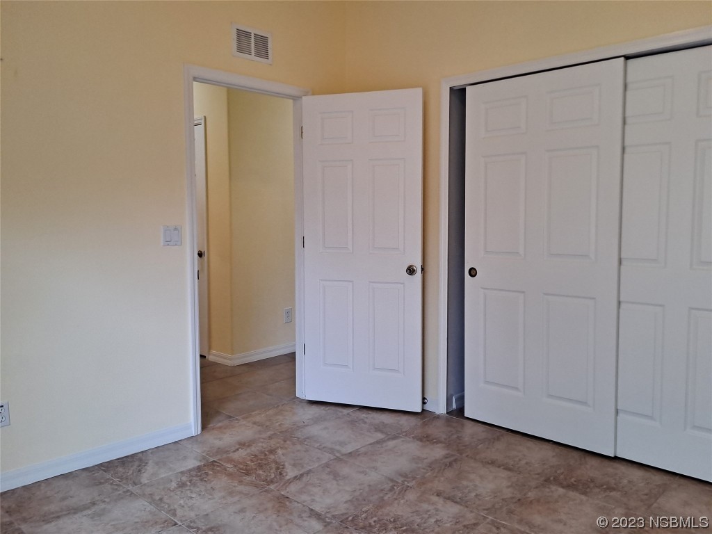 334 Airport Road New Smyrna Beach, FL 32168 - Photo 27 of 33 an empty room with closet area