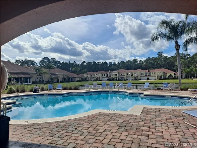 a view of a lake with a house in the background
