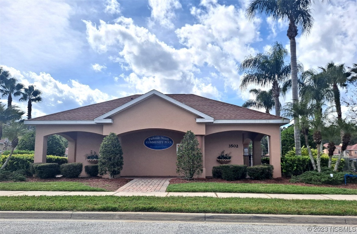 334 Airport Road New Smyrna Beach, FL 32168 - Photo 33 of 33 a view of a house with a yard and large tree
