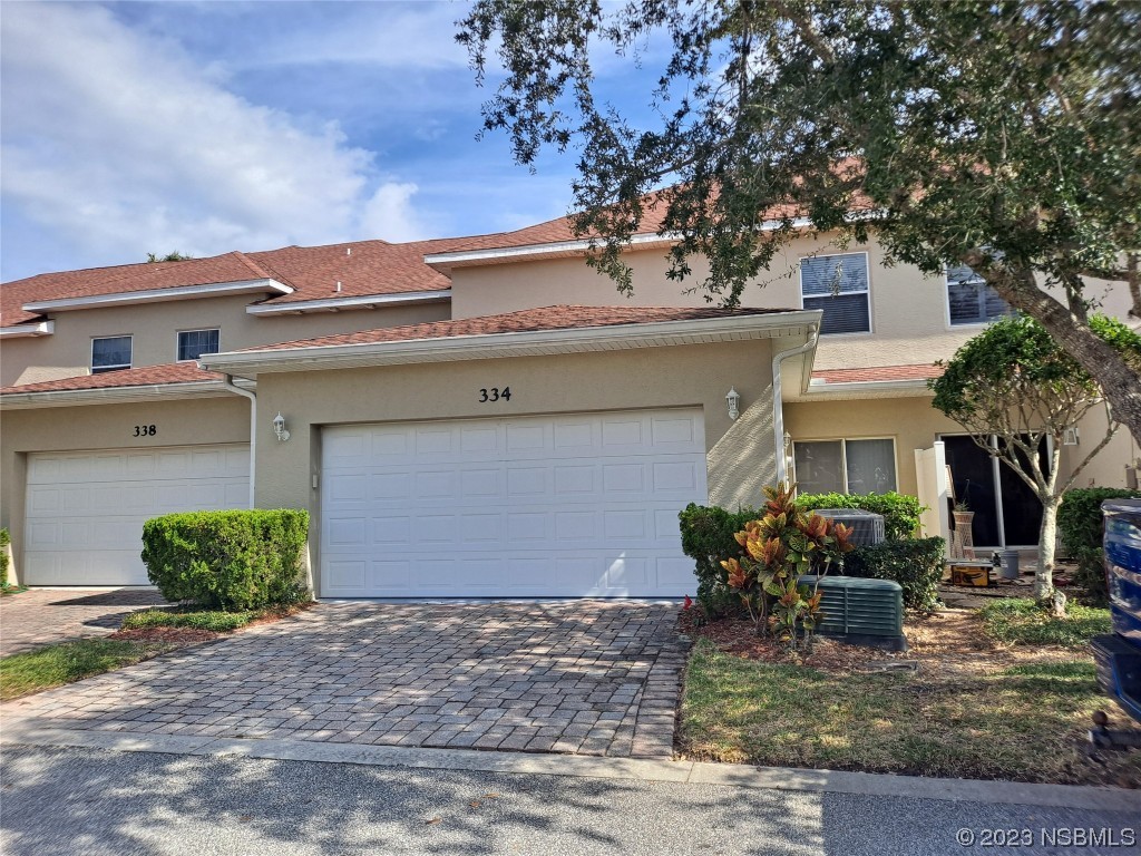 334 Airport Road New Smyrna Beach, FL 32168 - Photo 4 of 33 a front view of a house with garden