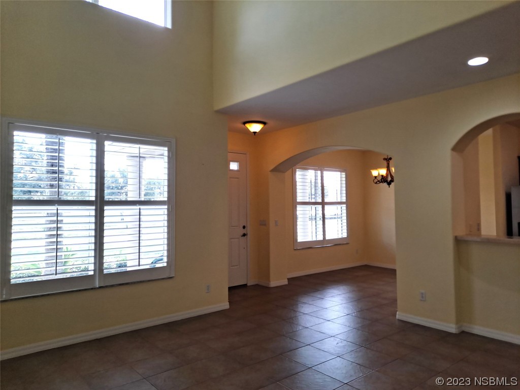 334 Airport Road New Smyrna Beach, FL 32168 - Photo 6 of 33 a view of livingroom with hardwood floor and window