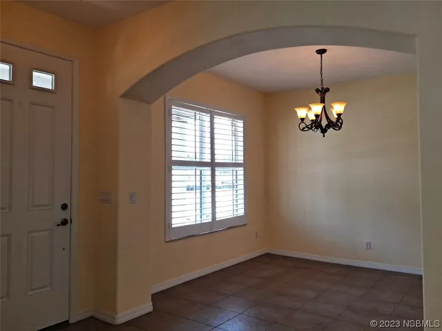 a view of a windows and chandelier in a room