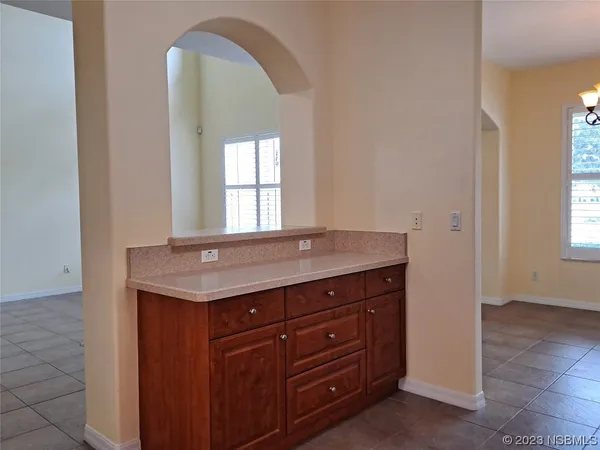 a room with a sink and a mirror