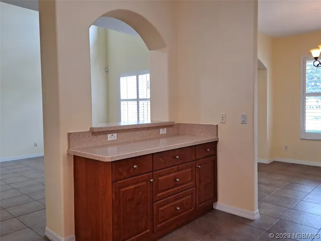 a room with a sink and a mirror