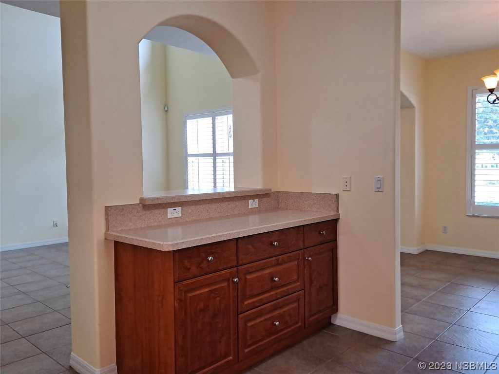 334 Airport Road New Smyrna Beach, FL 32168 - Photo 10 of 33 a room with a sink and a mirror