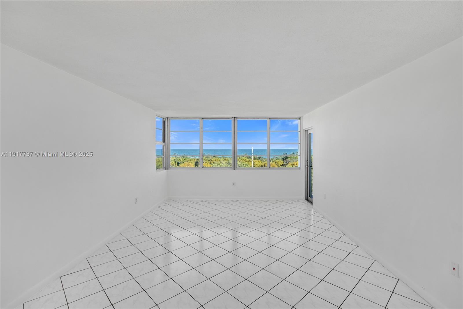 8000 Harding Avenue, Unit 7F Miami Beach, FL 33141 - Photo 13 of 46 a view of an empty room and window