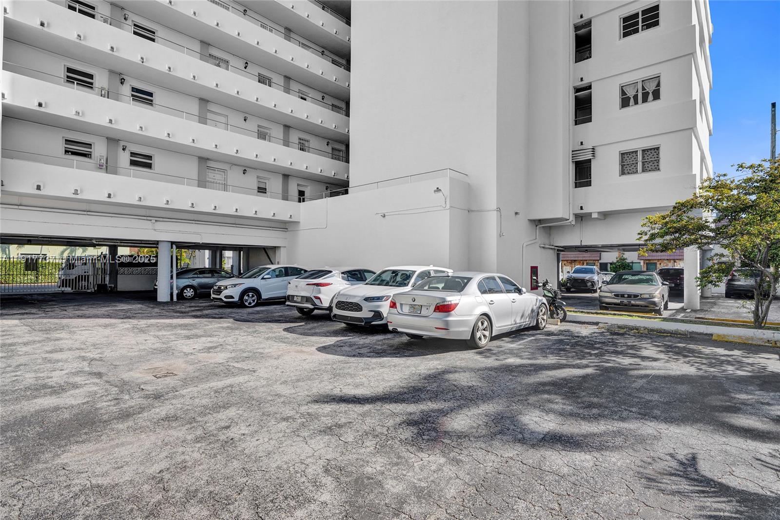 8000 Harding Avenue, Unit 7F Miami Beach, FL 33141 - Photo 26 of 46 a car parked in front of a building