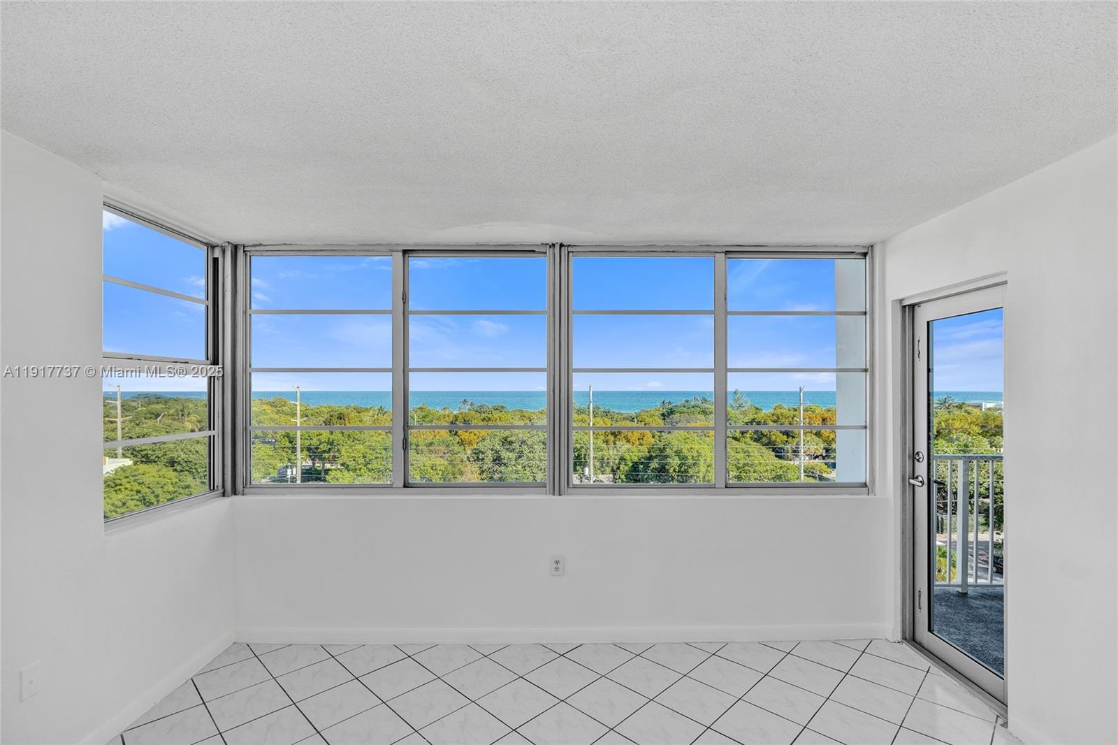 8000 Harding Avenue, Unit 7F Miami Beach, FL 33141 - Photo 10 of 46 a view of an empty room and window