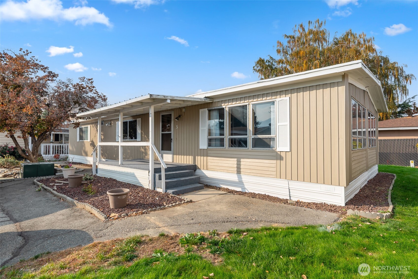 1608 North Western Avenue, Unit 3 Wenatchee, WA 98801 - Photo 1 of 26 a front view of a house with a garage