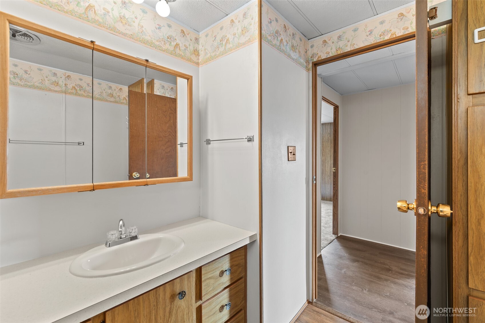 1608 North Western Avenue, Unit 3 Wenatchee, WA 98801 - Photo 15 of 26 a bathroom with a sink and a mirror