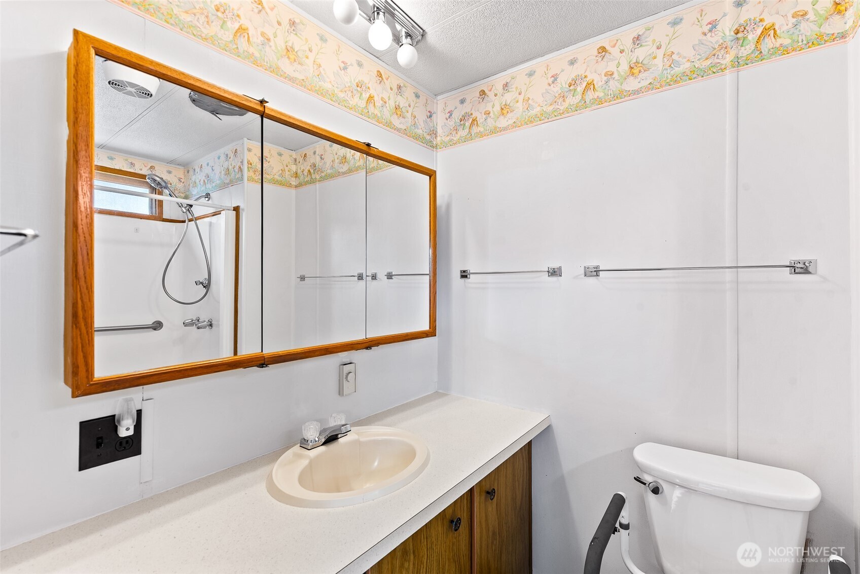 1608 North Western Avenue, Unit 3 Wenatchee, WA 98801 - Photo 18 of 26 a bathroom with a sink mirror vanity and toilet