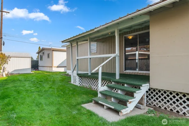 a view of a deck in the backyard