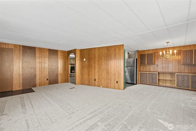 a view of an empty room with glass door