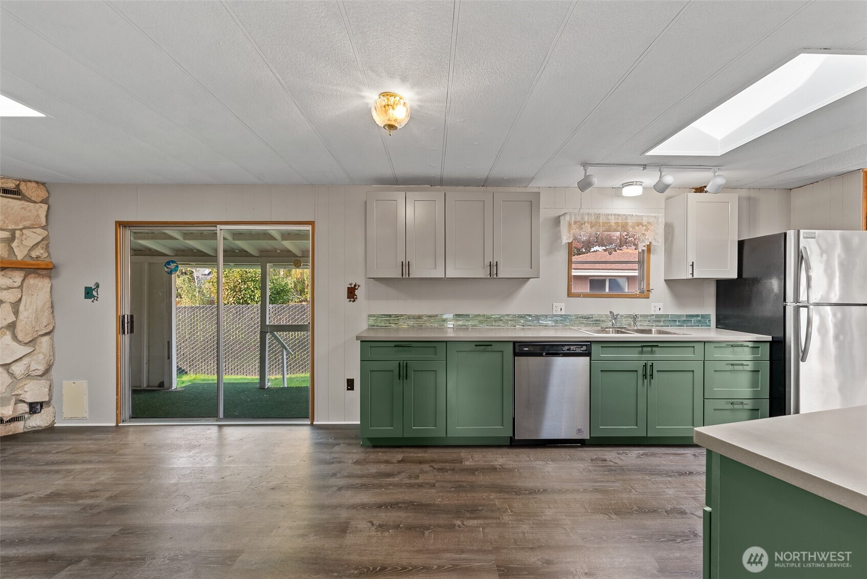 1608 North Western Avenue, Unit 3 Wenatchee, WA 98801 - Photo 9 of 26 a kitchen with stainless steel appliances granite countertop a refrigerator and a sink