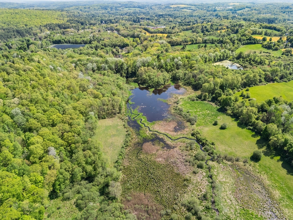 0 Center Road Dudley, MA 01571 - Photo 4 of 12 an aerial view of a houses with a yard