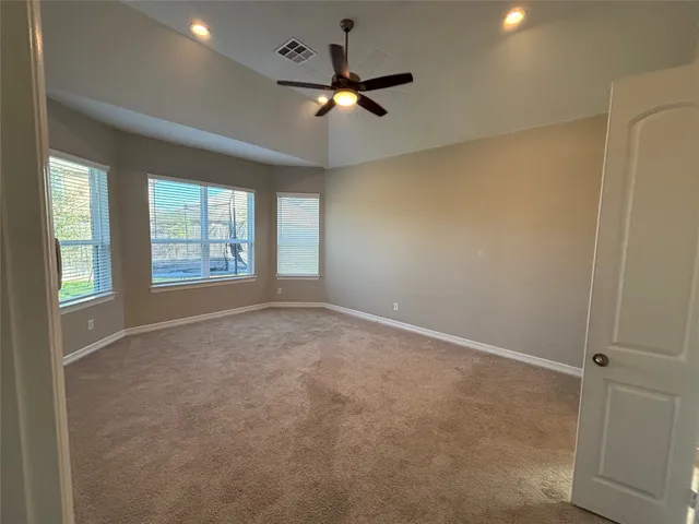 a kitchen with granite countertop a refrigerator and a stove
