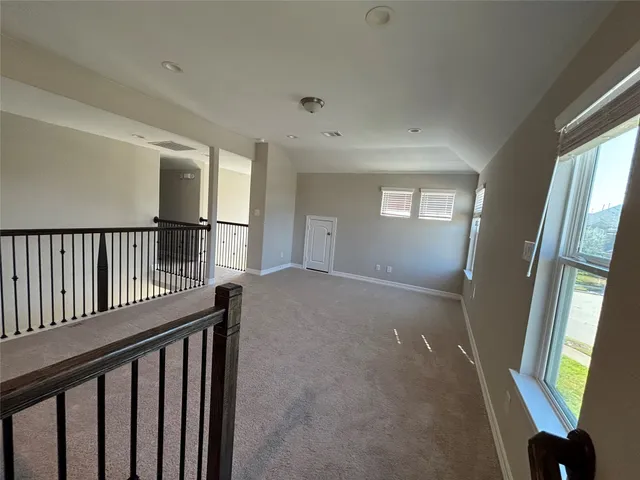 a view of a house with swimming pool and a yard