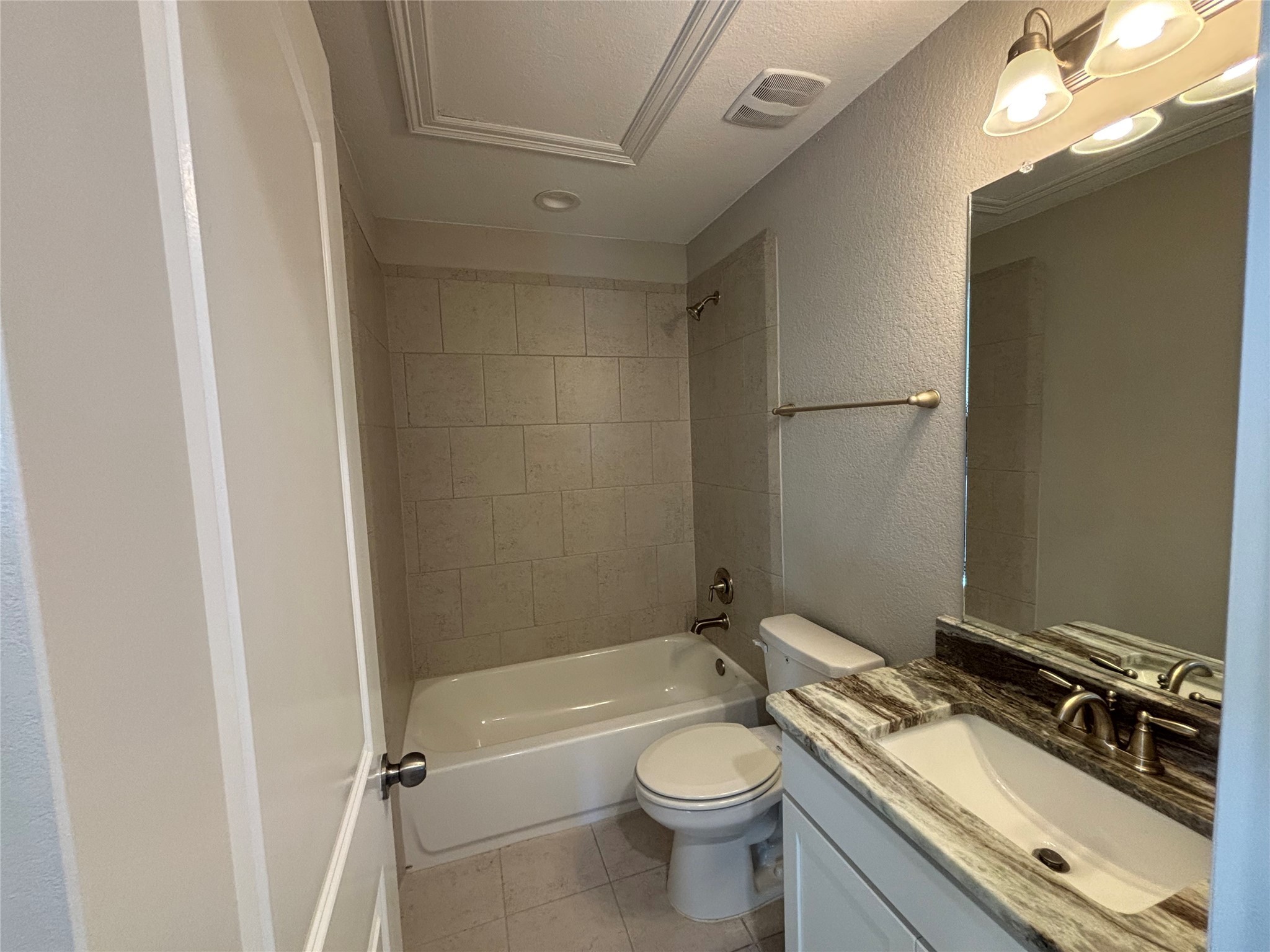 20826 Stonebreak Lane Spring, TX 77379 - Photo 30 of 37 a bathroom with a granite countertop toilet sink and mirror